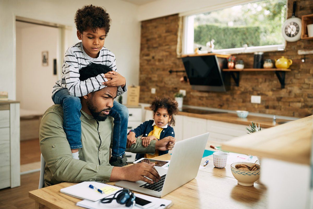 Stay-at-home father working in a home office