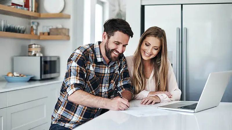 Young couple managing finances online